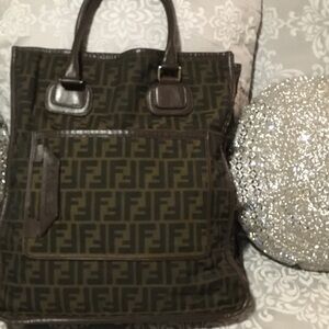 Ladies Fendi Hand Bag. The bag is 39 inches in length and 36 inches in width.